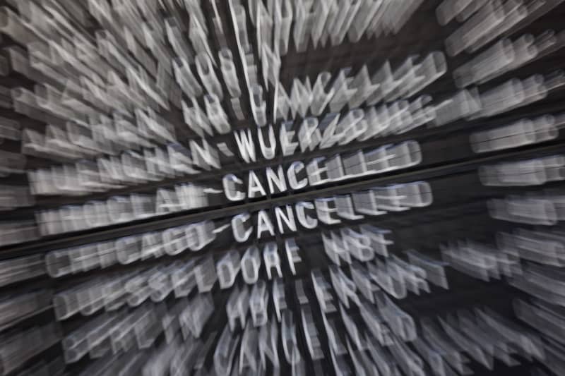 A display board showing flights that have been canceled due to the strike at one of 11 major German airports that have started a one-day strike. Jörg Halisch/dpa