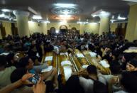 Relatives of murdered Coptic Christians mourn their deaths at a funeral in Abu Garnous Cathedral in Egypt's north Minya town of Maghagha on May 26, 2017