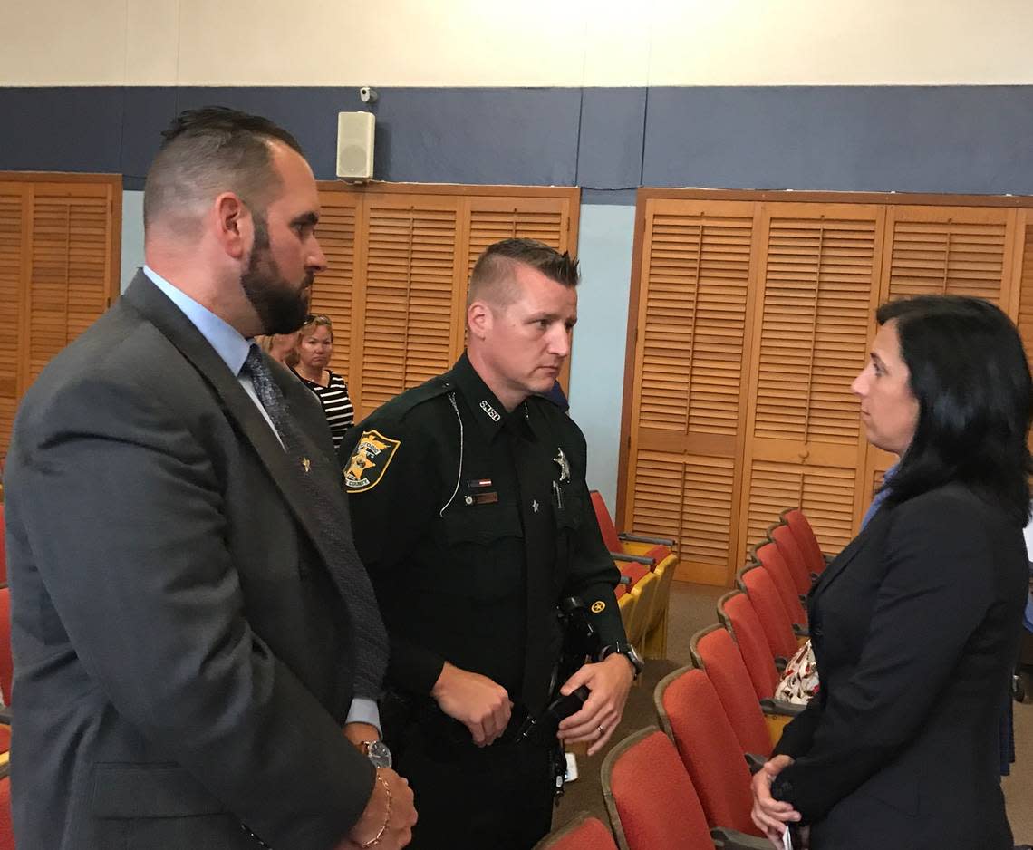 Monroe County Sheriff’s Office Sgt. David Lariz and St. John’s County Sheriff’s Office Deputy Joshua Gordon speak with Assistant State Attorney Colleen Dunne following the guilty verdict of Timothy Thomas on April 25, 2018, at the Plantation Key courthouse. Thomas shot Gordon in the chest when Gordon was a Monroe County Sheriff’s Office deputy. Dunne faces disciplinary action from the Florida Bar for reportedly withholding discovery evidence in a 2009 attempted murder case. David Goodhue/dgoodhue@keysreporter.com