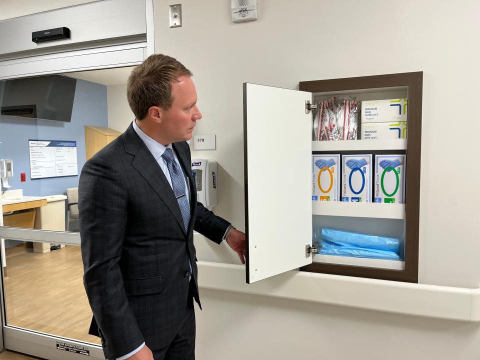 Jeremy Barclay, chief executive officer at St. David's Round Rock Medical Center, shows the new built-in personal protective equipment closets next to each room in the expansion. This feature design came out of the COVID-19 pandemic.