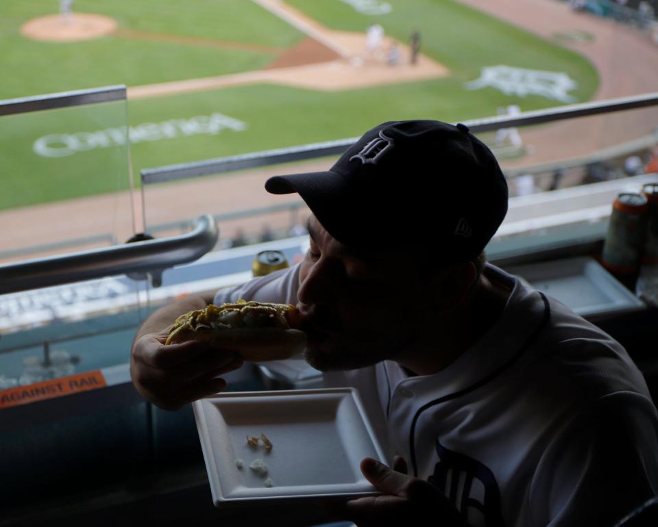 DSO conductor Jader Bignamini sampled a hot dog while touring Comerica Park on June 14, 2022.