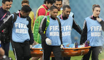Iran's goalkeeper Alireza Beiranvand is carried out of the stadium injured during the World Cup group B soccer match between England and Iran at the Khalifa International Stadium in in Doha, Qatar, Monday, Nov. 21, 2022. (AP Photo/Martin Meissner)