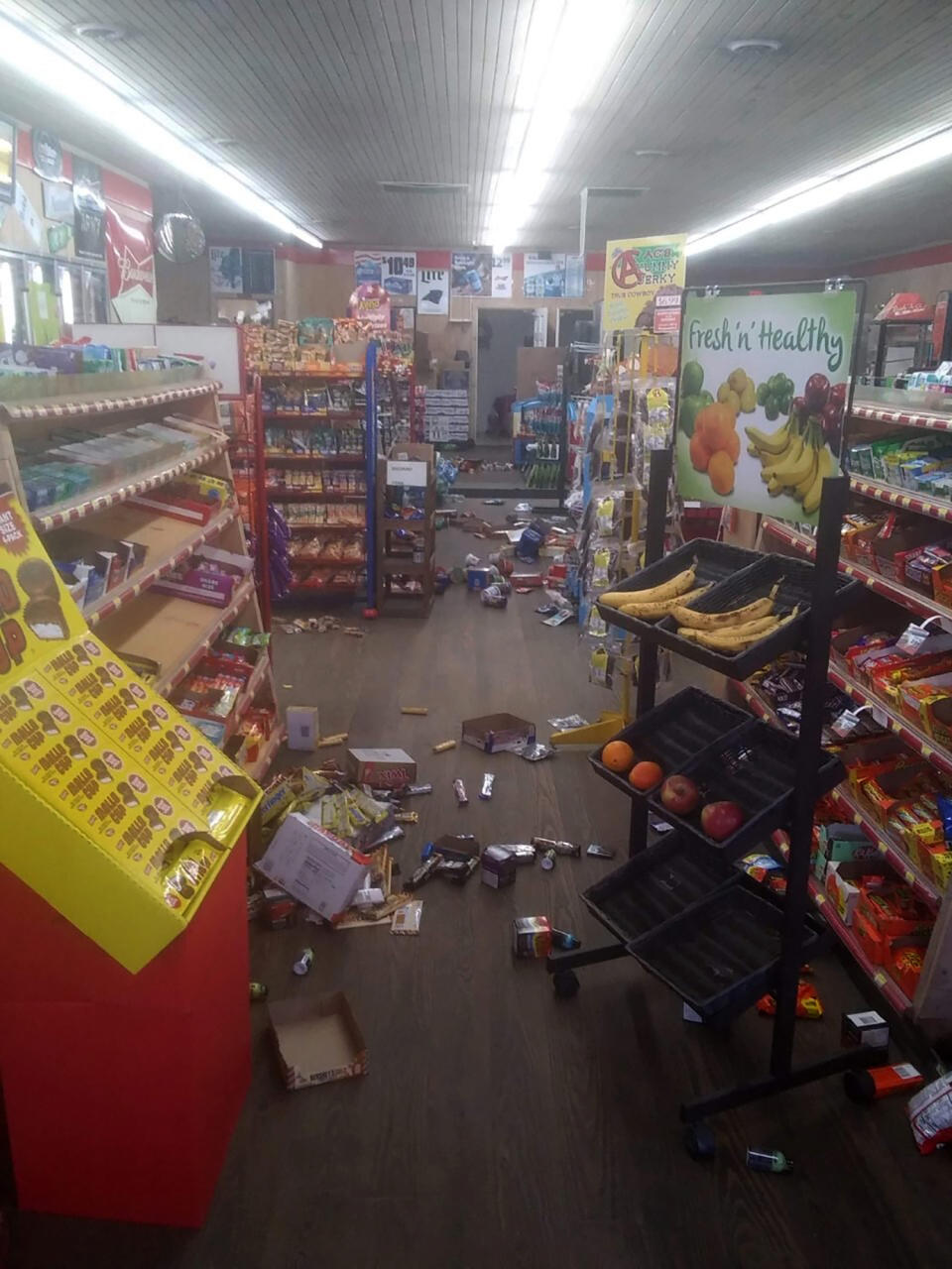 Various items litter the floor of the 4 Brothers Store in Sparta, N.C. after an earthquake shook much of North Carolina early Sunday, Aug. 9, 2020. (Michael Hull via AP)