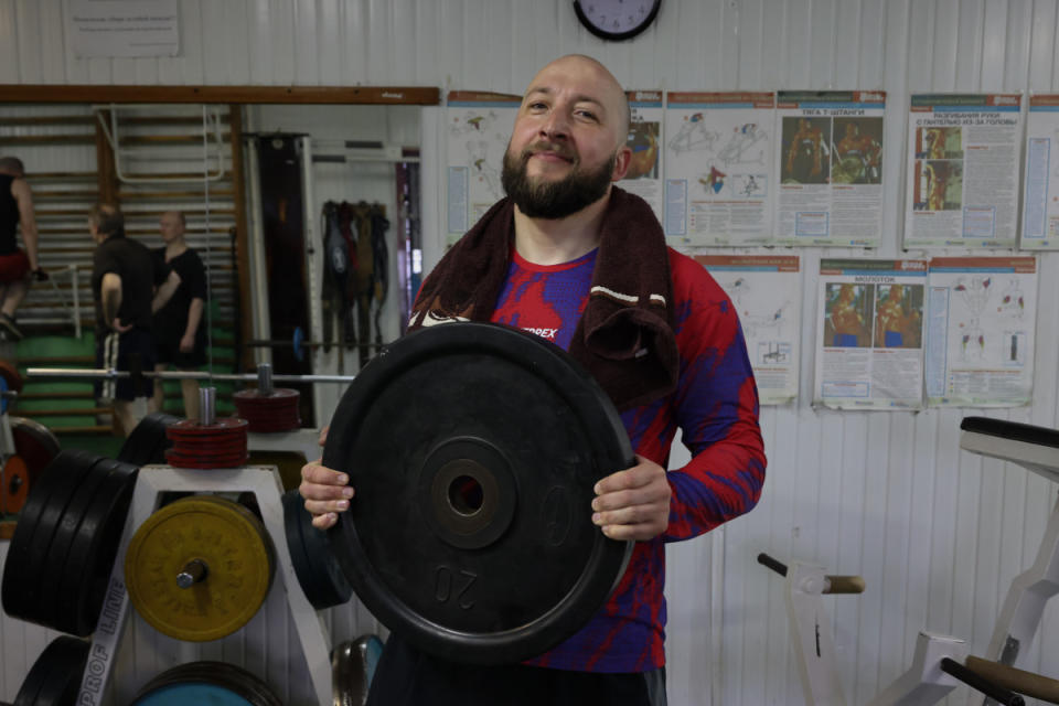 Volodymyr holds a weight in his hands, preparing for his next exercise.<p>Nikoletta Stoyanova</p>