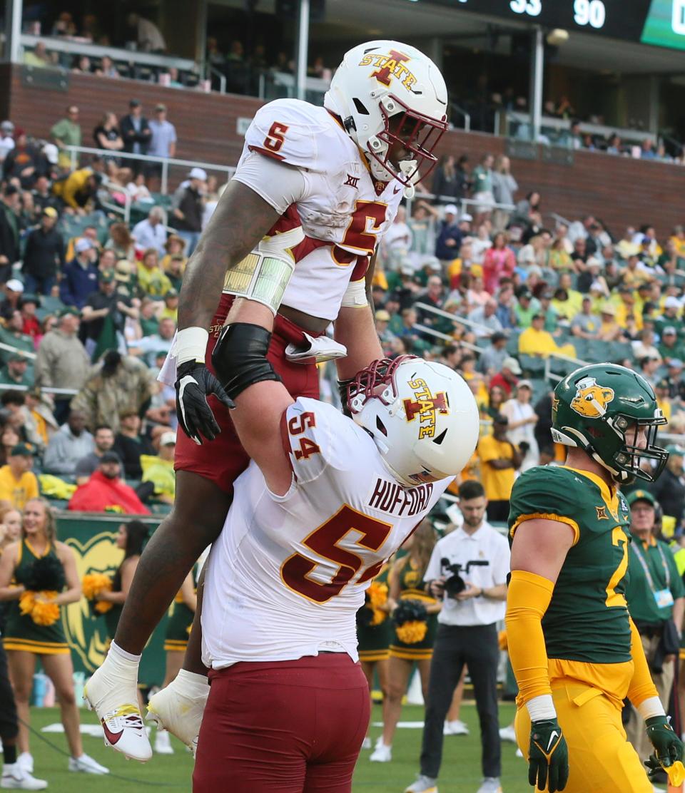 Iowa State running back Cartevious Norton (5) is lifted by offensive lineman Jarrod Hufford (54) after scoring a touchdown at Baylor on Oct. 28.