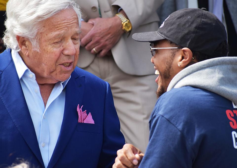 Bob Kraft, Chairman and CEO, New England Patriots, talks with Patriots player Kendrick Bourne at the ribbon cutting for the renovated DCF house for youth and young adults Wednesday, May 11, in Fall River.