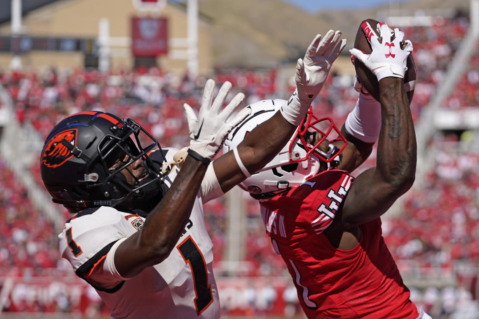 Utah cornerback Clark Phillips III, right, intercepts the ball from Oregon State wide receiver Tyjon Lindsey (1) during the second half of an NCAA college football game, Saturday, Oct. 1, 2022, in Salt Lake City. (AP Photo/Rick Bowmer)