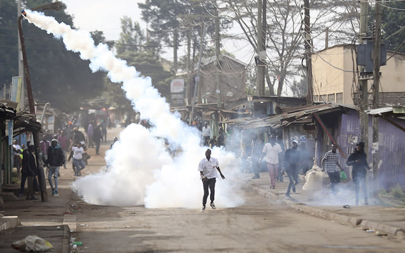 A teargas canister flies through the air on March 20 as police clash with protesters in Nairobi, Kenya