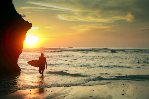 Nowhere does sunset surf shots like Bali - Credit: Getty