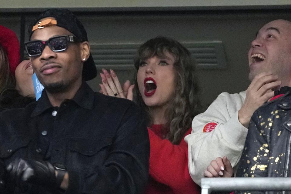 Taylor Swift, center, reacts during the first half of the AFC Championship NFL football game between the Baltimore Ravens and the Kansas City Chiefs, Sunday, Jan. 28, 2024, in Baltimore. (AP Photo/Nick Wass)