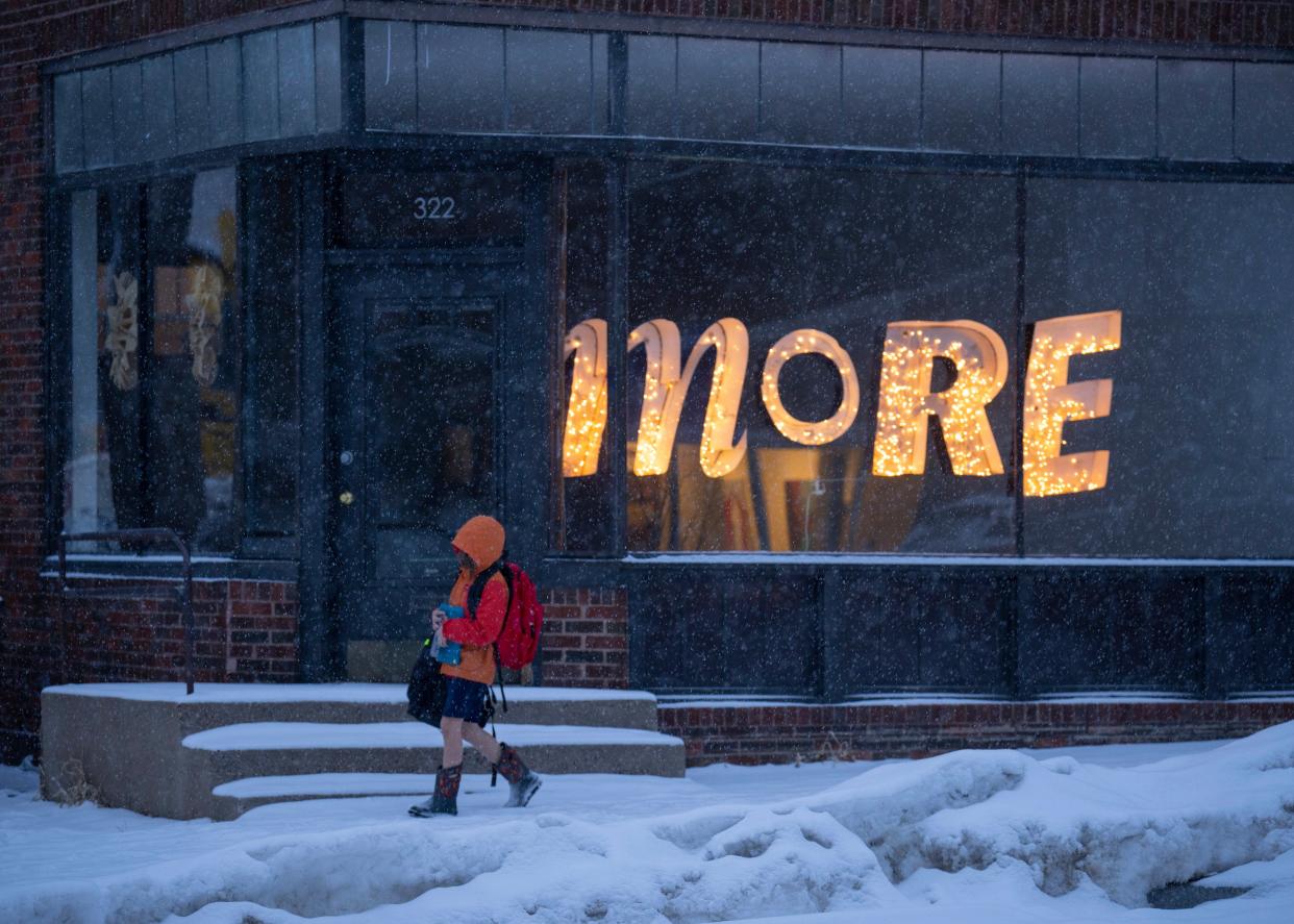 A youngster walks home from school in Minneapolis as snow falls from a winter storm hitting the Twin Cities on Tuesday (Jeff Wheeler/Star Tribune via AP) (AP)