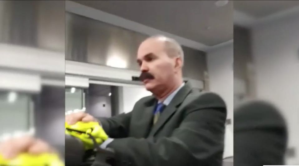 Passenger Yossi Adler confronted an American Airlines employee in a cellphone video after he and his family were removed for their alleged body odor. (Photo: Screenshot via WPLG)