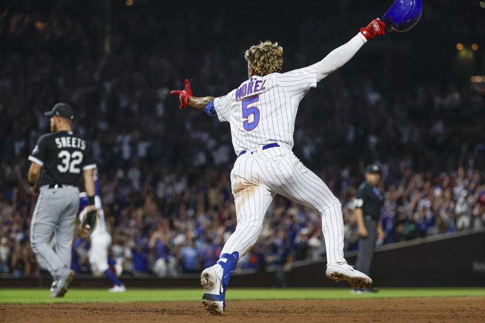 Aug 16, 2023; Chicago, Illinois, USA; Chicago Cubs second baseman Christopher Morel (5) celebrates as he rounds the bases after hitting a three-run walk-off home run against the Chicago White Sox during the ninth inning at Wrigley Field. Mandatory Credit: Kamil Krzaczynski-USA TODAY Sports