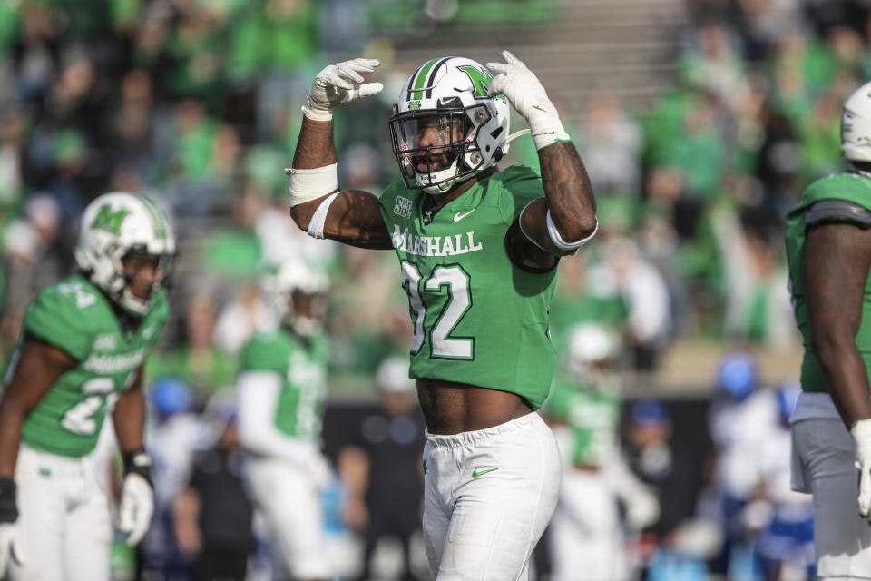 Marshall's Koby Cumberlander hypes up the crowd as the Herd takes on Georgia State during an NCAA football game on Saturday, Nov. 26, 2022, at Joan C. Edwards Stadium in Huntington W.Va./The Herald-Dispatch via AP)
