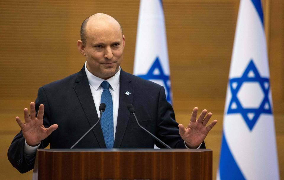 Israel's Prime Minister Naftali Bennett makes a joint statement to the press with Foreign Minister Yair Lapid (unseen) in Jerusalem on June 20, 2022. Bennett said Lapid "will soon take over" as premier, after the pair agreed to dissolve their fraught governing coalition and trigger new elections.
