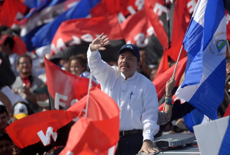 Nicaraguan President Daniel Ortega waves to supporters during the commemoration of the 39th Anniversary of the Sandinista Revolution