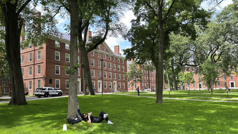 A person relaxes at Harvard University on Thursday, June 29, 2023, in Cambridge, Mass. The Supreme Court on Thursday struck down affirmative action in college admissions, declaring race cannot be a factor and forcing institutions of higher education to look for new ways to achieve diverse student bodies.