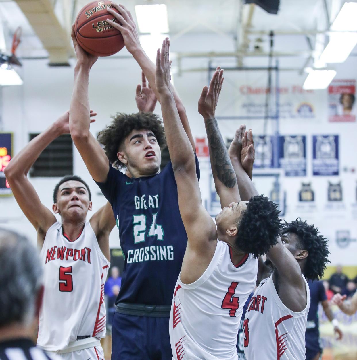 Great Crossing's Malachi Moreno (24) goes for two against Newport at Thursday's 2023 Chad Gardner Law King of the Bluegrass holiday basketball tournament at Fairdale High School. Dec. 21, 2023