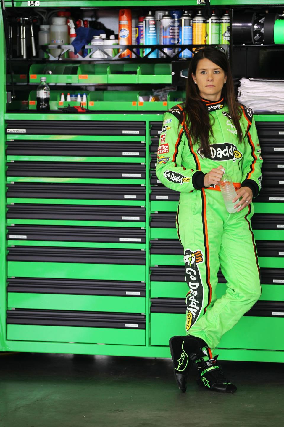 DAYTONA BEACH, FL - FEBRUARY 18: Danica Patrick, driver of the #10 GoDaddy.com Chevrolet, stands in the garage during practice for the NASCAR Sprint Cup Series Daytona 500 at Daytona International Speedway on February 18, 2012 in Daytona Beach, Florida. (Photo by Jamie Squire/Getty Images)