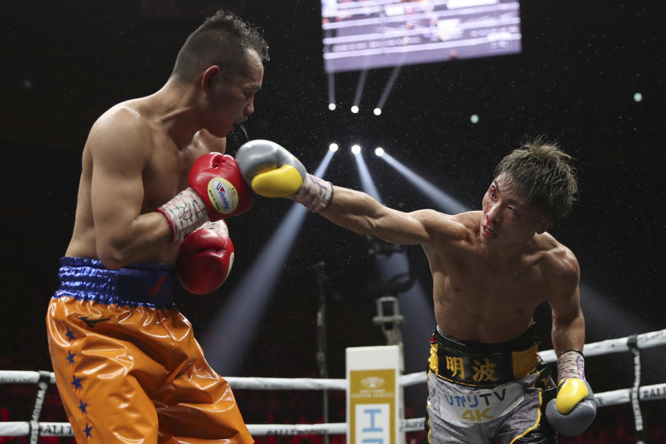 Japan's Naoya Inoue, right, sends a right to Philippines' Nonito Donaire in the eighth round of their World Boxing Super Series bantamweight final match in Saitama, Japan, Thursday, Nov. 7, 2019. Inoue beat Donaire with a unanimous decision to win the championship. (AP Photo/Toru Takahashi)
