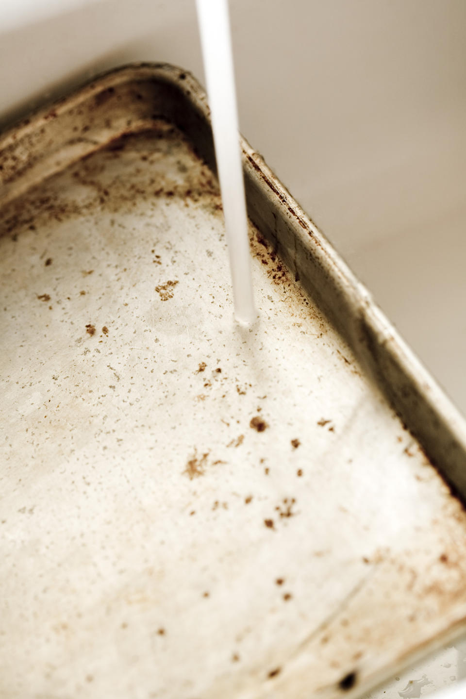 Those ground-on stains are hard to remove from baking trays. (Getty Images)