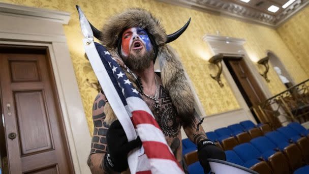 PHOTO: Jacob Chansley, also known as the 'QAnon Shaman,' screams 'Freedom' inside the U.S. Senate chamber after the Capitol was breached by a mob during a joint session of Congress, Jan. 6, 2021. (Win Mcnamee/Getty Images)