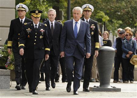 From L-R: Vice Chairman of the Joint Chiefs Adm. Sandy Winnefeld, Chairman of the Joint Chiefs Gen. Martin Dempsey, Navy Secretary Ray Mabus, Defense Secretary Chuck Hagel and Chief of Naval Operations Adm. Jonathan Greenert arrive at a ceremony at the Navy Memorial in Washington, honoring the victims of an attack at the Navy Yard, at the Navy Memorial in Washington, September 17, 2013. REUTERS/Mike Theiler