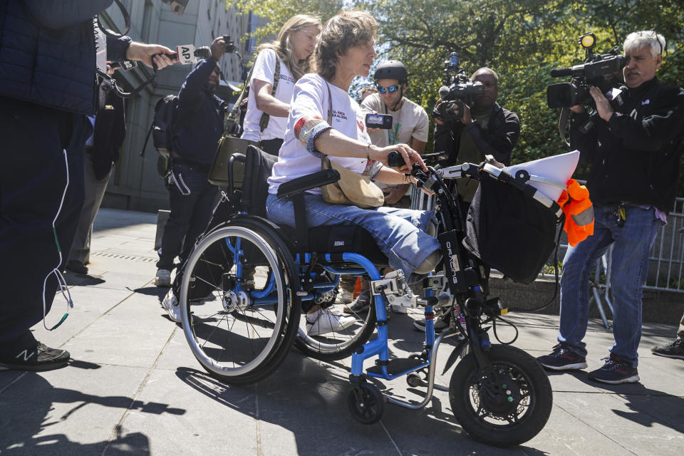 Marion Van Reeth leaves Manhattan federal court after making a victim statement at the sentencing of convicted Islamic extremist Sayfullo Saipov, Wednesday May 17, 2023, in New York. Saipov carried out an attack on Halloween in 2017 when he ran his rented truck onto a bike path in lower Manhattan killing eight people and injuring others, including Reeth, who lost her legs in the attack. (AP Photo/Bebeto Matthews)