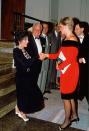 <p>It wasn't the first time they were introduced, but Joan Collins still went all out for the opening night of the play <em>Private Lives </em>with her elegant black and white dress. </p>