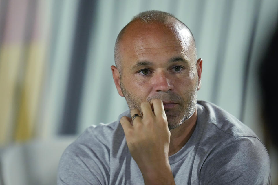 FILE - Former Spain player Andres Iniesta talks to reporters as the team works out during his Spain's official training session at Qatar University, in Doha, Qatar, on Nov. 30, 2022. Iniesta is scheduled to hold a press conference on Thursday, May 25, 2023. (AP Photo/Julio Cortez, File)