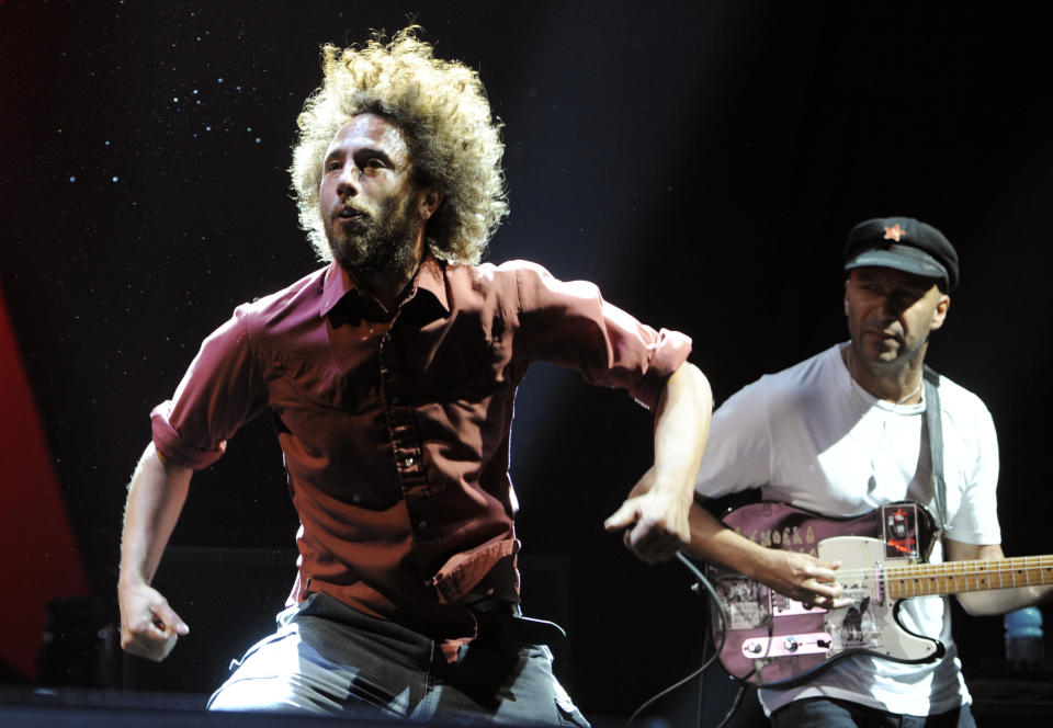 Zack de la Rocha, left, and Tom Morello of the band Rage Against the Machine perform during their headlining set at the "L.A. Rising" concert at the Los Angeles Coliseum, Saturday, July 30, 2011, in Los Angeles. (AP Photo/Chris Pizzello)