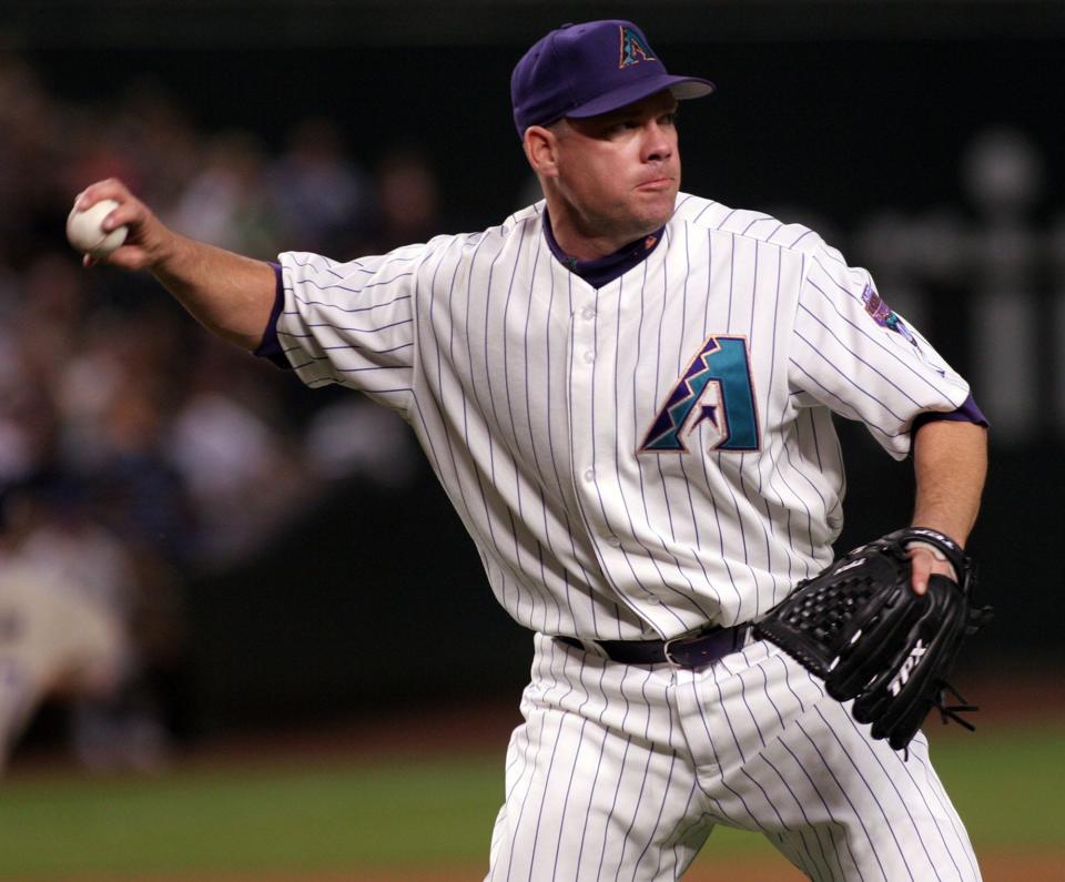 This file photo from May 16, 2006 shows Arizona Diamondbacks Jason Grimsley fielding a ground ball against the San Diego Padres in Phoenix.