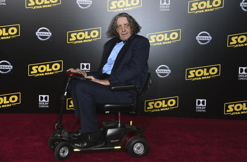 RETRANSMISSION TO CORRECT DAY AND DATE OF DEATH - FILE - This May 10, 2018 file photo shows Peter Mayhew at the premiere of "Solo: A Star Wars Story" in Los Angeles. Mayhew, who played the rugged, beloved and furry Wookiee Chewbacca in the “Star Wars” films, has died. Mayhew died at his home in north Texas on Tuesday, April 30, 2019 according to a family statement. He was 74. No cause was given. (Photo by Jordan Strauss/Invision/AP, File)