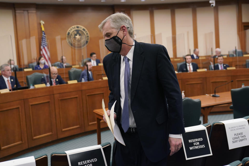 Thad Hill, Calpine President and CEO, prepares to answerer questions a the Committees on State Affairs and Energy Resources holds a joint public hearing to consider the factors that led to statewide electrical blackouts, Thursday, Feb. 25, 2021, in Austin, Texas. The hearings were the first in Texas since a blackout that was one of the worst in U.S. history, leaving more than 4 million customers without power and heat in subfreezing temperatures. (AP Photo/Eric Gay)