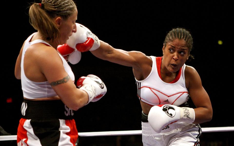 Laila Ali throws a right to Shelley Burton during the WBC Super Middleweight Championship in 2006 - GETTY IMAGES