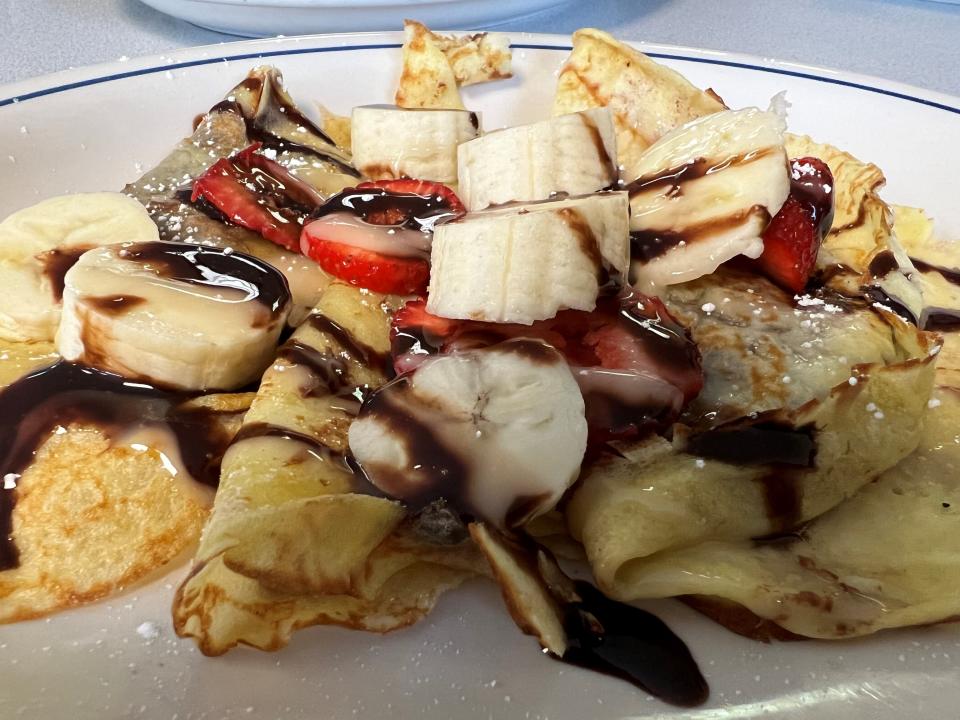 The dulce de leche crepe at Cafe con Leche comes with bananas, strawberries, dulce de leche, lechera and whipped cream. Yes, it's pretty decadent.