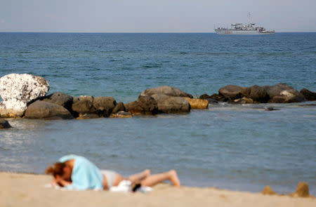 An Italian Navy vessel patrols on the sea in front of Taormina, Italy, May 24, 2017. REUTERS/Tony Gentile