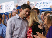 Republican vice presidential candidate Rep. Paul Ryan (R-WI) (L) hugs his wife Janna during a homecoming campaign rally at the Waukesha County Expo Center on August 12, 2012 in Waukesha, Wisconsin. (Photo by Justin Sullivan/Getty Images)