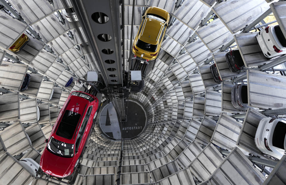 File---File photo shows cars ready for handing over inside one of in total two 'car towers' at the Volkswagen car factory in Wolfsburg, Germany, Monday, Nov. 8, 2021. (AP Photo/Michael Sohn, file)