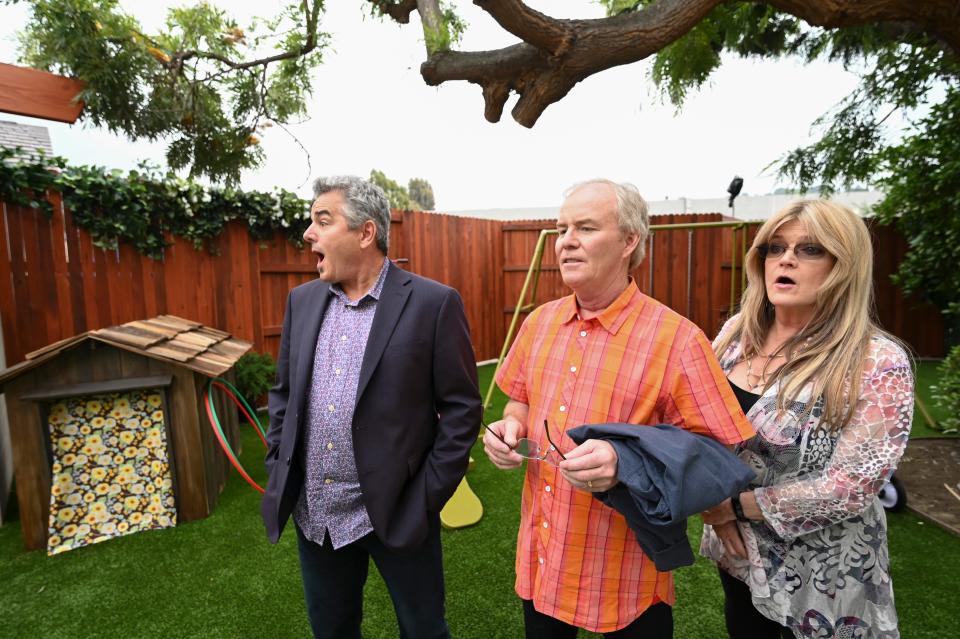 'Brady Bunch' stars Christopher Knight, left, Mike Lookinland and Susan Olsen take in the re-created backyard of the Los Angeles home that served as the exterior for the ABC family sitcom, which ran from 1969 to 1974. HGTV has rebuilt and redesigned the interior to mirror the show's iconic sets.