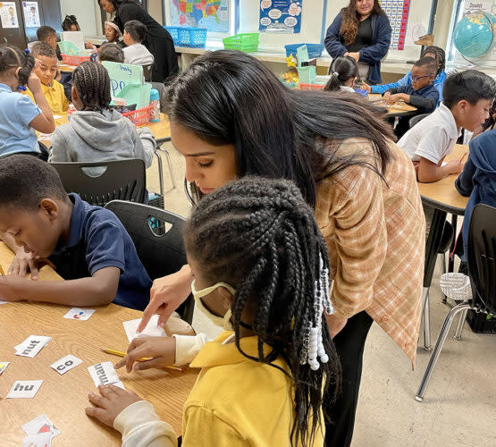 Jessica Rodriguez is one of hundreds of classroom assistants the district hired to provide more support in the early grades. She has since become a “bilingual cultural mentor.” (Linda Jacobson/The 74)