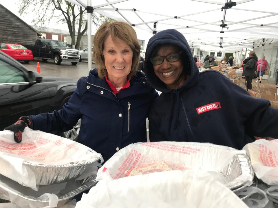 The Well volunteers Judy Lindner and Annette Ellerby helped to distribute bags of Thanksgiving goodies to over 300 families on Sunday.