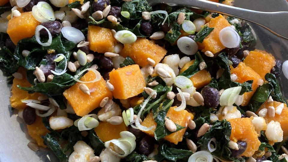 three sisters salad, main ingredients include black beans, hominy, green onions, roasted squash, kale, and garlic powder