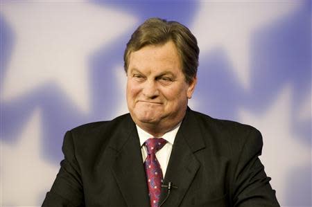 Incumbent Congressman Mike Simpson (R-ID) listens to challenger Bryan Smith at the televised debate for the upcoming Republican primary election at the studios of Idaho Public Television in Boise, Idaho May 11, 2014. REUTERS/Patrick Sweeney