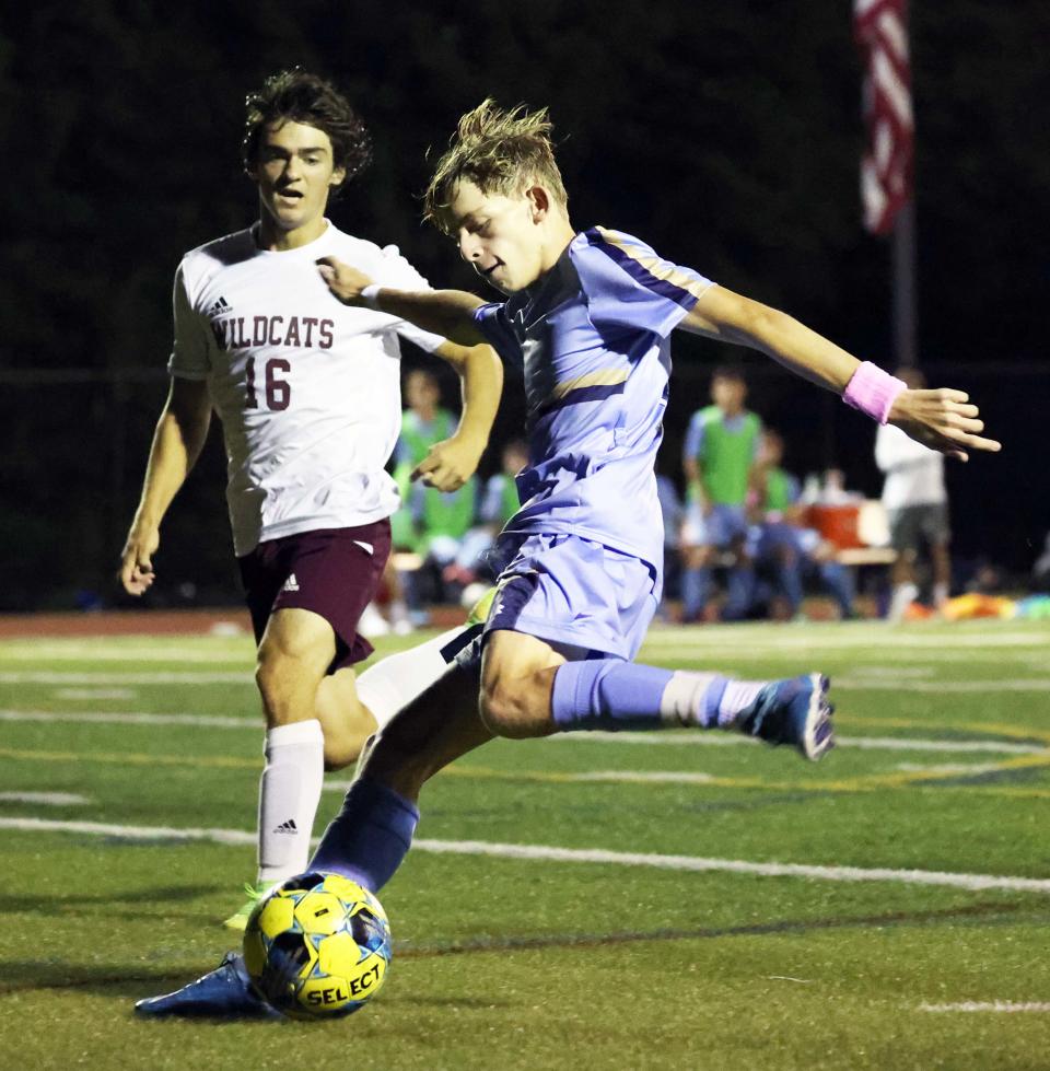 East Bridgewater's Jayden Wilson takes a shot on the keeper next to West Bridgewater's Derek Cashman during a game on Wednesday, Sept. 14, 2022.  