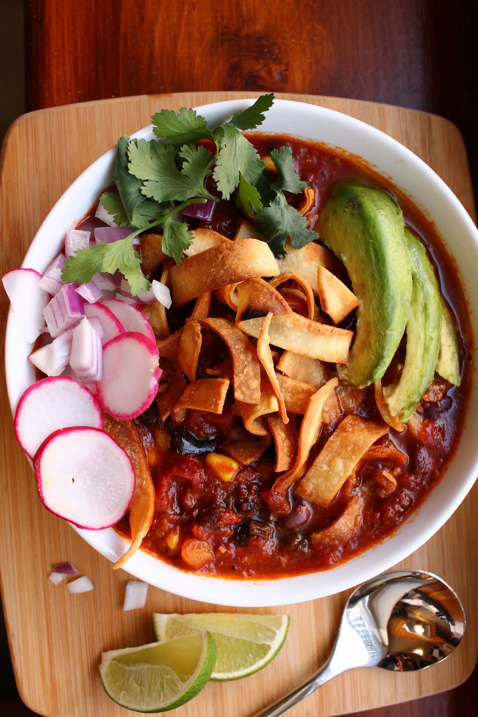 <p>We’re piling on the flavor here, because "vegan" doesn't mean missing out on any of the fun! There's three kinds of chili peppers, three kinds of canned tomatoes, hominy for chew, creamy black beans for protein, a medley of spices, all topped with a wondrous assortment of toppings: fried tortillas, raw onions and radish slices, rich avocado, and a squidge of lime juice to brighten it all up a notch.</p><p>Get the <strong><a href="https://www.delish.com/cooking/recipe-ideas/a34776718/vegan-tortilla-soup-recipe/" rel="nofollow noopener" target="_blank" data-ylk="slk:Vegan Tortilla Soup recipe;elm:context_link;itc:0;sec:content-canvas" class="link ">Vegan Tortilla Soup recipe</a></strong>.</p>