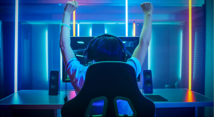 cloud gaming: Gamer Playing and Winning in First-Person Shooter Online Video Game on His Personal Computer