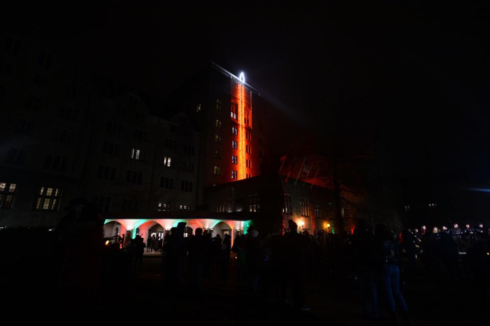 The “candle” on the Biddle Hotel tower of the Indiana Memorial Union lights up in 2019 as part of the inaugural “Light Up the Night” holiday celebration.