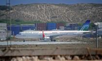 A picture taken on February 3, 2016 shows a plane operated by Daallo Airlines, after it made an emergency landing on February 2 in Mogadishu following a blast