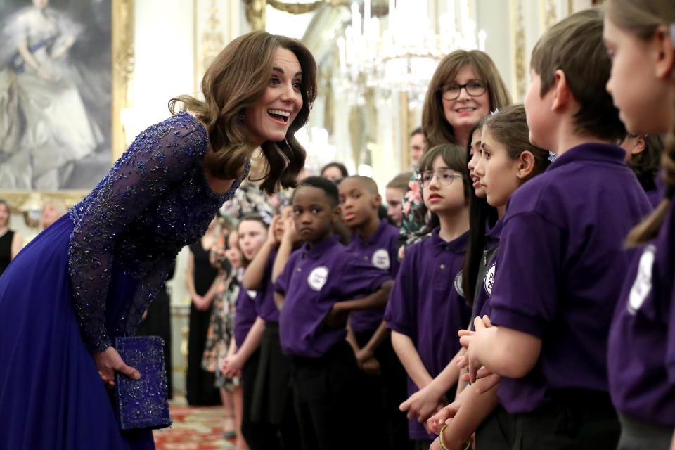 LONDON, ENGLAND - MARCH 09: Catherine, Duchess of Cambridge speaks with a school choir as she hosts a Gala Dinner in celebration of the 25th anniversary of Place2Be at Buckingham Palace on March 09, 2020 in London, England. The Duchess is Patron of Place2Be, which provides emotional support at an early age and believes no child should face mental health difficulties alone. (Photo by Chris Jackson - WPA Pool/Getty Images)